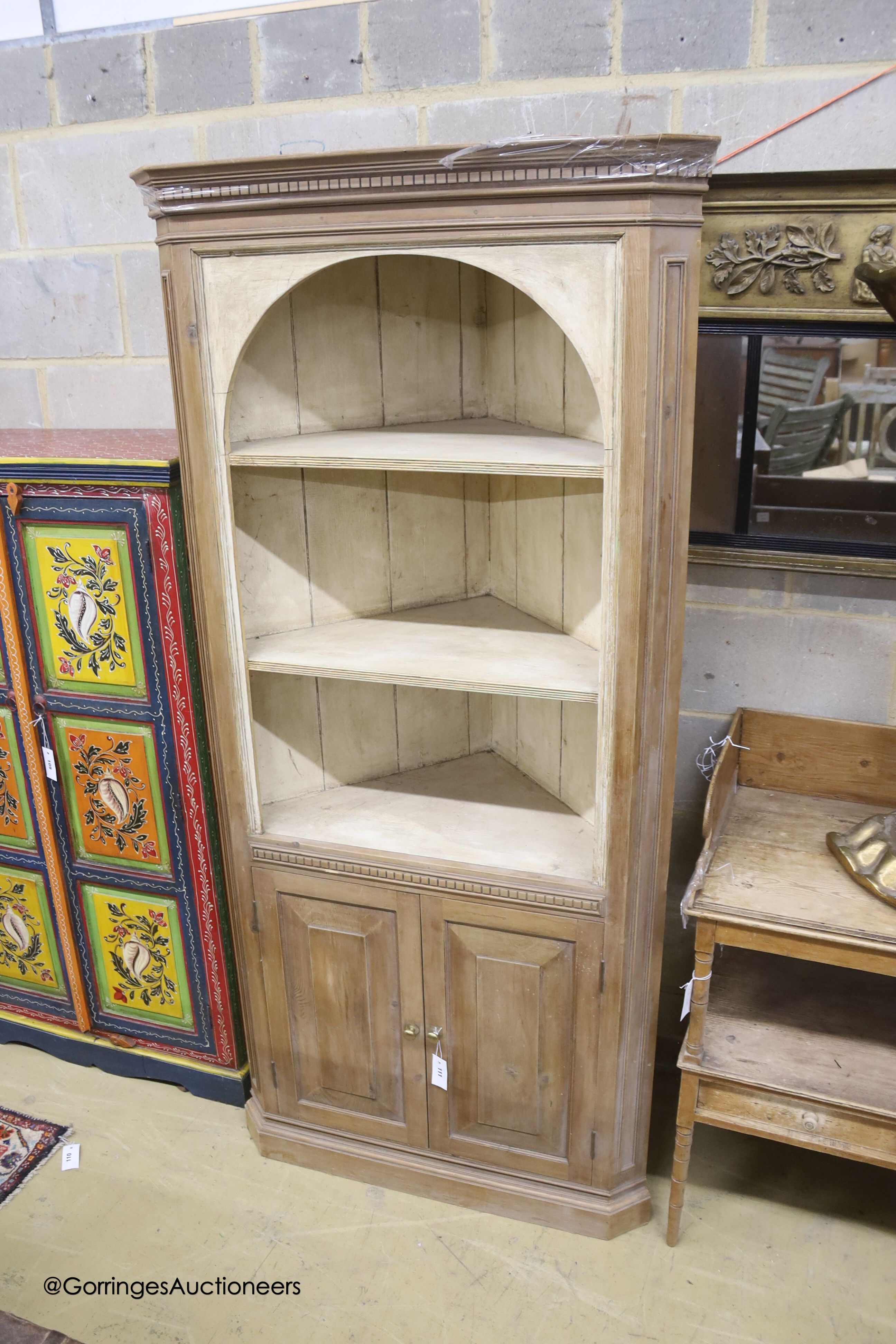 A George III style pine standing corner cabinet, width 86cm depth 45cm height 191cm